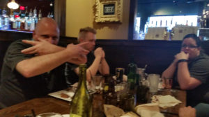 Some family being silly at dinner