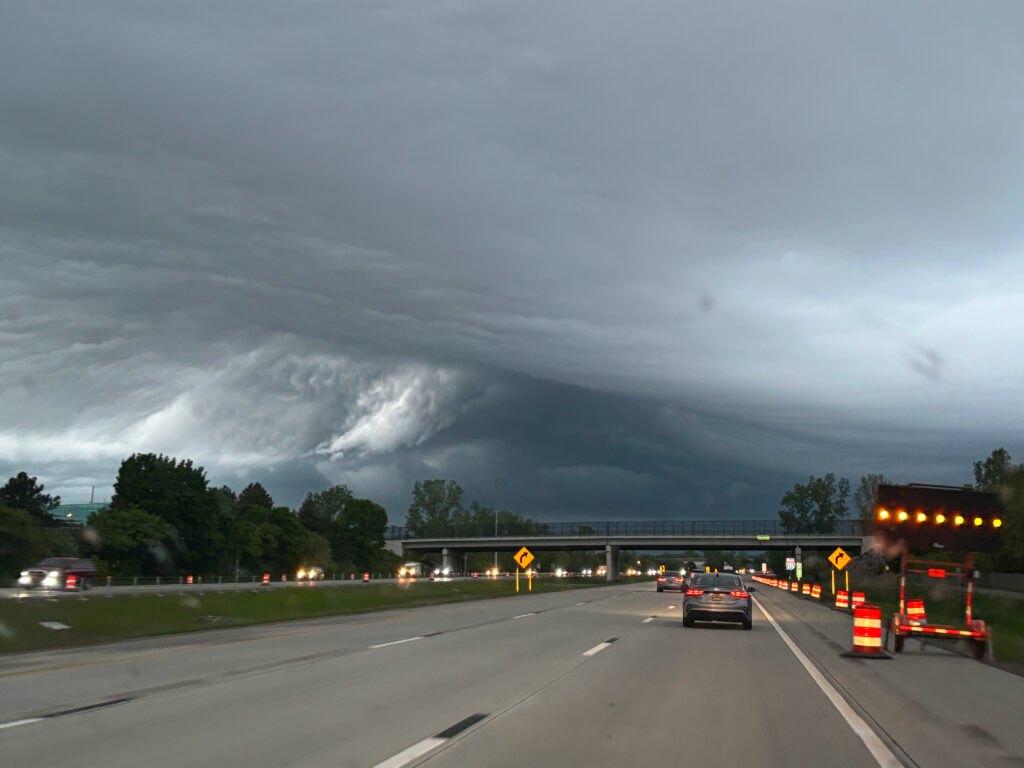 Dramatic storm cloud formation over a highway,